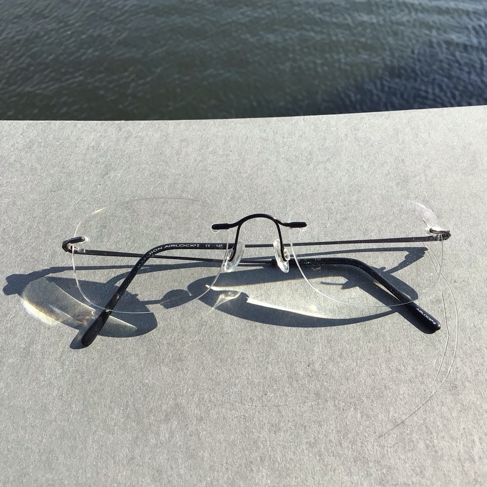 Marchon Airlock 2 760 32 140 Rimless Prescription Eyeglasses - Black Temples